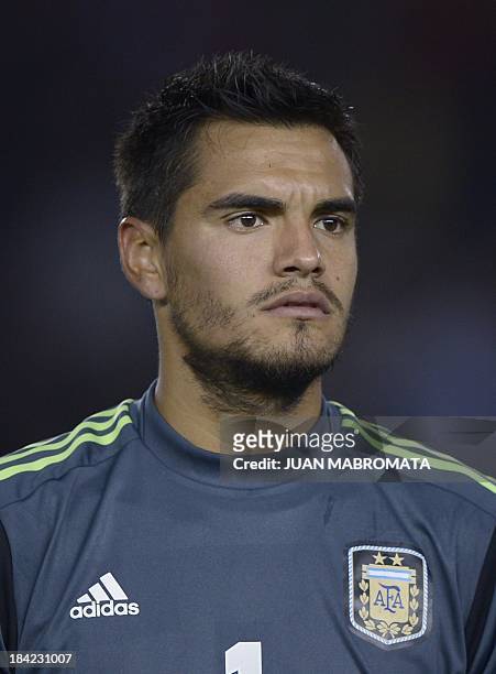 Argentina's goalkeeper Sergio Romero looks on before the Brazil 2014 World Cup South American qualifier football match against Peru at the Monumental...