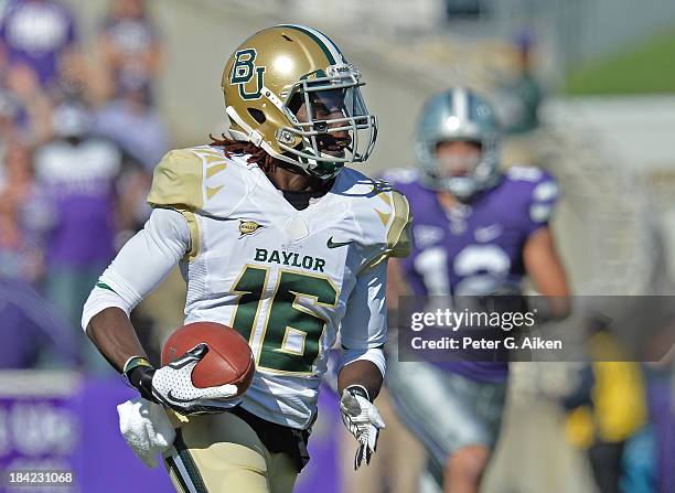 Wide receiver Tevin Reese of the Baylor Bears catches a 93-yard touchdown pass against the Kansas State Wildcats during the first half on October 12,...