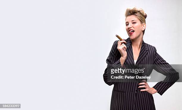 businesswoman smoking cigar with copy space - beautiful women smoking cigars fotografías e imágenes de stock