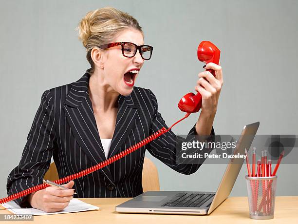 angry businesswoman - furious stock-fotos und bilder