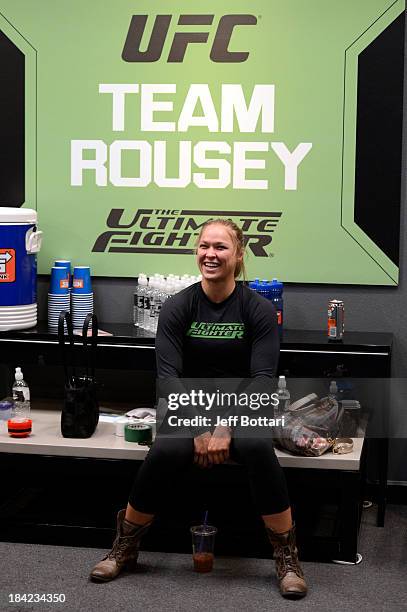 Coach Ronda Rousey sits in the locker room prior to the matchup between Raquel Pennington and Jessamyn Duke in their preliminary fight during filming...