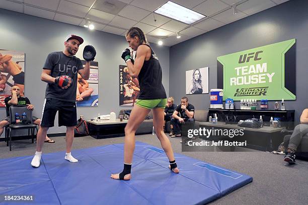 Team Rousey trainer Edmond Tarverdyan trains with Jessamyn Duke before her preliminary fight against Raquel Pennington during filming of season...