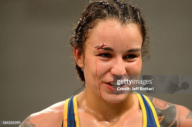 Raquel Pennington celebrates after defeating Jessamyn Duke after their preliminary fight during filming of season eighteen of The Ultimate Fighter on...