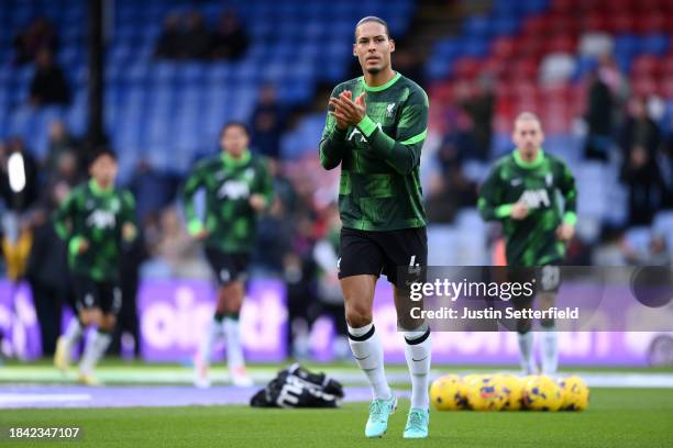 Virgil van Dijk of Liverpool acknowledges the fans during the warm up prior to the Premier League match between Crystal Palace and Liverpool FC at...