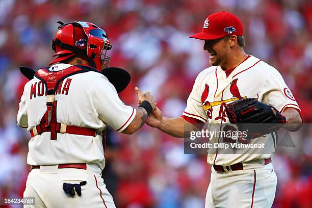 Trevor Rosenthal of the St. Louis Cardinals celebrates with Yadier Molina after their 1 to 0 win over the Los Angeles Dodgers during Game Two of the...