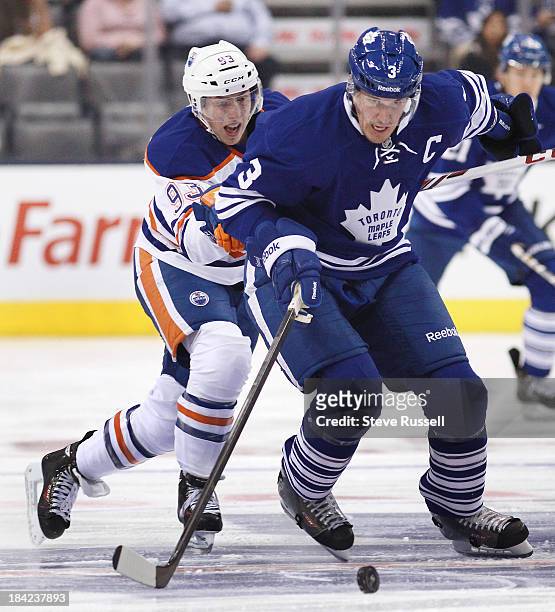 Toronto Maple Leafs defenseman Dion Phaneuf gets away from Edmonton Oilers center Ryan Nugent-Hopkins as the Toronto Maple Leafs play the Edmonton...
