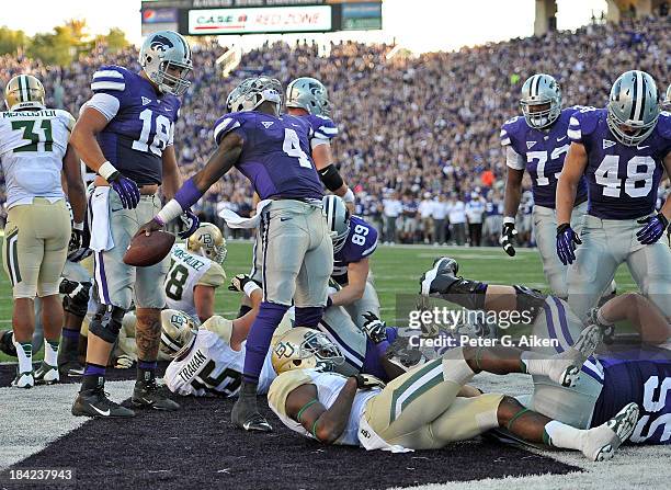 Quarterback Daniel Sams of the Kansas State Wildcats celebrates after scoring a touchdown against the Baylor Bears during the second half on October...