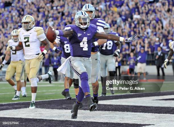 Quarterback Daniel Sams of the Kansas State Wildcats celebrates after scoring a touchdown against the Baylor Bears during the second half on October...