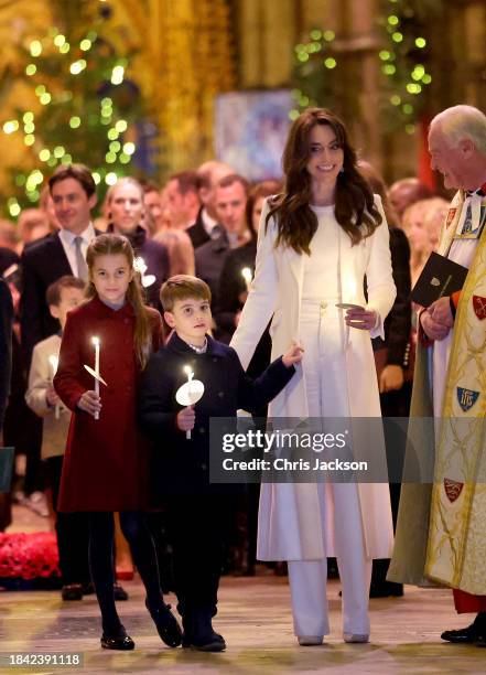 Catherine, Princess of Wales, Prince Louis of Wales and Princess Charlotte of Wales, process out of The "Together At Christmas" Carol Service at...