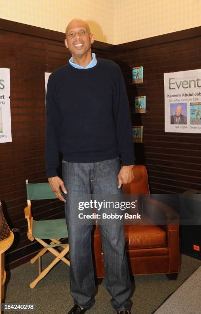 Kareem Abdul Jabbar signs copies of his new children's book "Sasquatch In The Paint" at Barnes & Noble bookstore at The Grove on October 12, 2013 in...