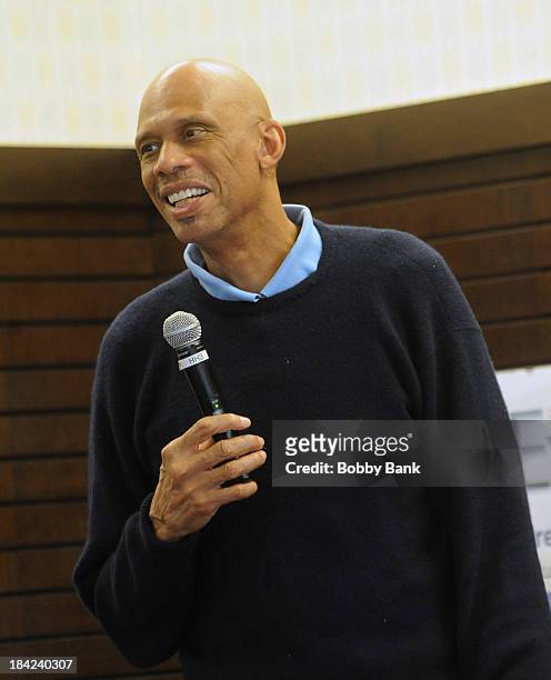 Kareem Abdul Jabbar signs copies of his new children's book "Sasquatch In The Paint" at Barnes & Noble bookstore at The Grove on October 12, 2013 in...