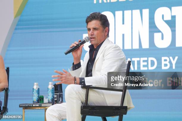 Journalist/ writer Leila Cobo and actor/author John Stamos attend the Tribeca Storytellers: John Stamos at the Tribeca Music Lounge during Art Basel...