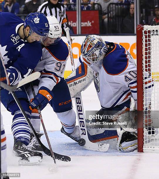 Toronto Maple Leafs center Jay McClement looks for the rebound with Ryan Nugent-Hopkins and Devan Dubnyk as the Toronto Maple Leafs beat the Edmonton...