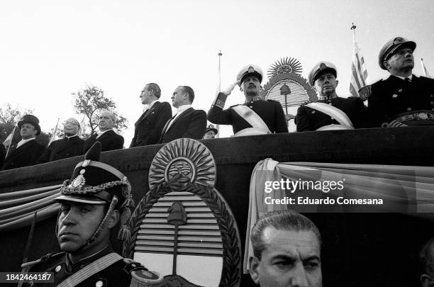 Argentine General & de facto President of Argentina Juan Carlos Onganía salutes as he reviews troops during an Independence Day parade, Buenos Aires,...