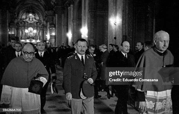 Accompanied by unidentified clergy, Argentine General & de facto President of Argentina Juan Carlos Onganía enters the Metropolitan Cathedral to...