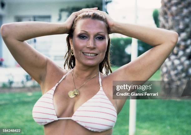 The Spanish singer Rocio Jurado in the pool at her house Madrid, Castilla La Mancha, Spain. .