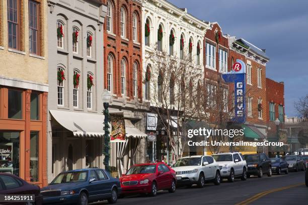 Historic Main Street with Red Brick Storefronts, parked cars and Grays Pharmacy in Franklin, Tennessee, a suburb south of Nashville, Williamson...