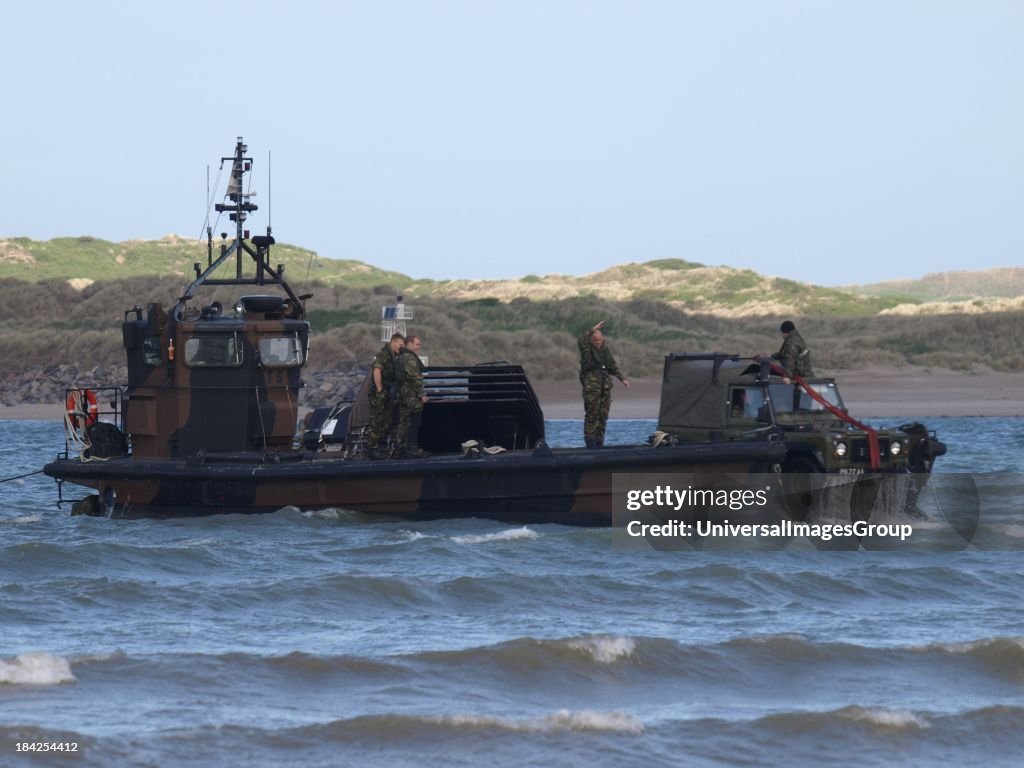 Royal Marines loading land rover onto landing craft, Instow, Devon ...