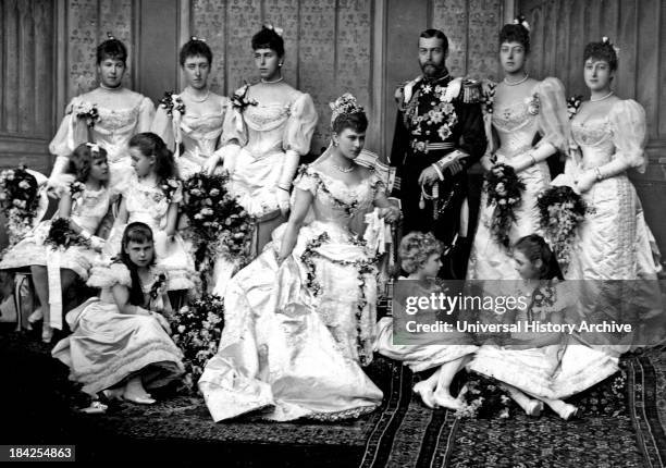 Portrait photograph in Buckingham Palace from the wedding of King George V and Princess Mary of Teck. Showing the family all posed in a group in...