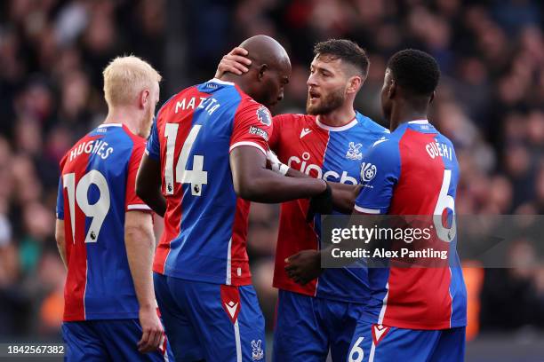 Jean-Philippe Mateta of Crystal Palace celebrates scoring his team's first goal with teammates Joel Ward and Marc Guehi during the Premier League...