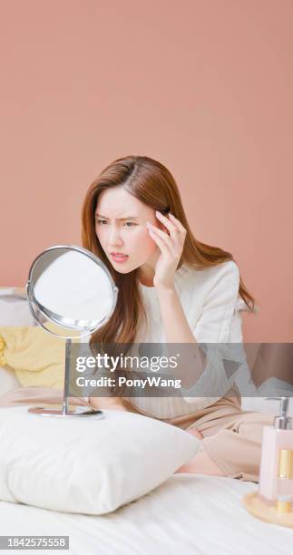 asian woman displeased facial skin - blackheads on face stock pictures, royalty-free photos & images