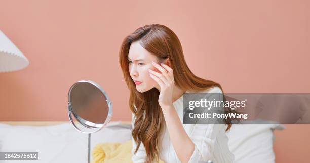asian woman displeased facial skin - blackheads on face stock pictures, royalty-free photos & images