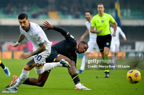 Mattia Zaccagni of SS Lazio compete for the ball with Jackson Tchatchoua of Hellas Verona during the Serie A TIM match between Hellas Verona FC and...