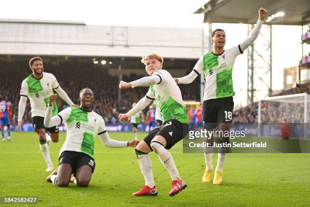 Harvey Elliott of Liverpool celebrates with Ibrahima Konate and Cody Gakpo after scoring his team's second goal during the Premier League match...