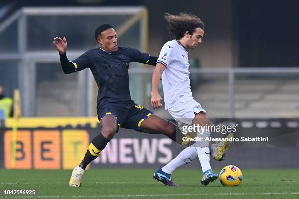 Matteo Guendouzi of SS Lazio is challenged by Michael Folorunsho of Hellas Verona FC during the Serie A TIM match between Hellas Verona FC and SS...