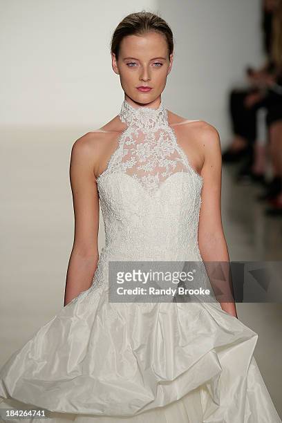 Model walks the runway at the Kenneth Pool Fall 2014 Bridal collection show on October 12, 2013 in New York City.