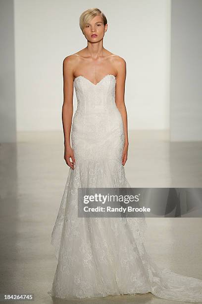 Model walks the runway at the Kenneth Pool Fall 2014 Bridal collection show on October 12, 2013 in New York City.