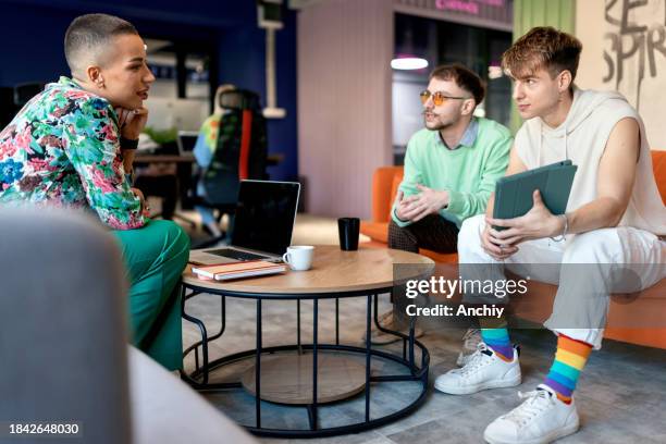 diverse group of people having a meeting in the modern it company - gay person stock pictures, royalty-free photos & images