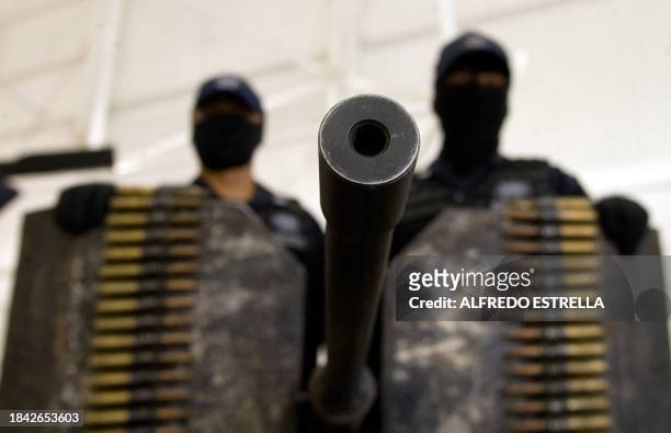 Mexican Federal Police officers show April 14, 2009 to the press at their Command Center in Mexico City, a Browning .50 antiaircraft machine gun...