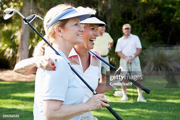 senior couples playing golf. - golf social stock pictures, royalty-free photos & images