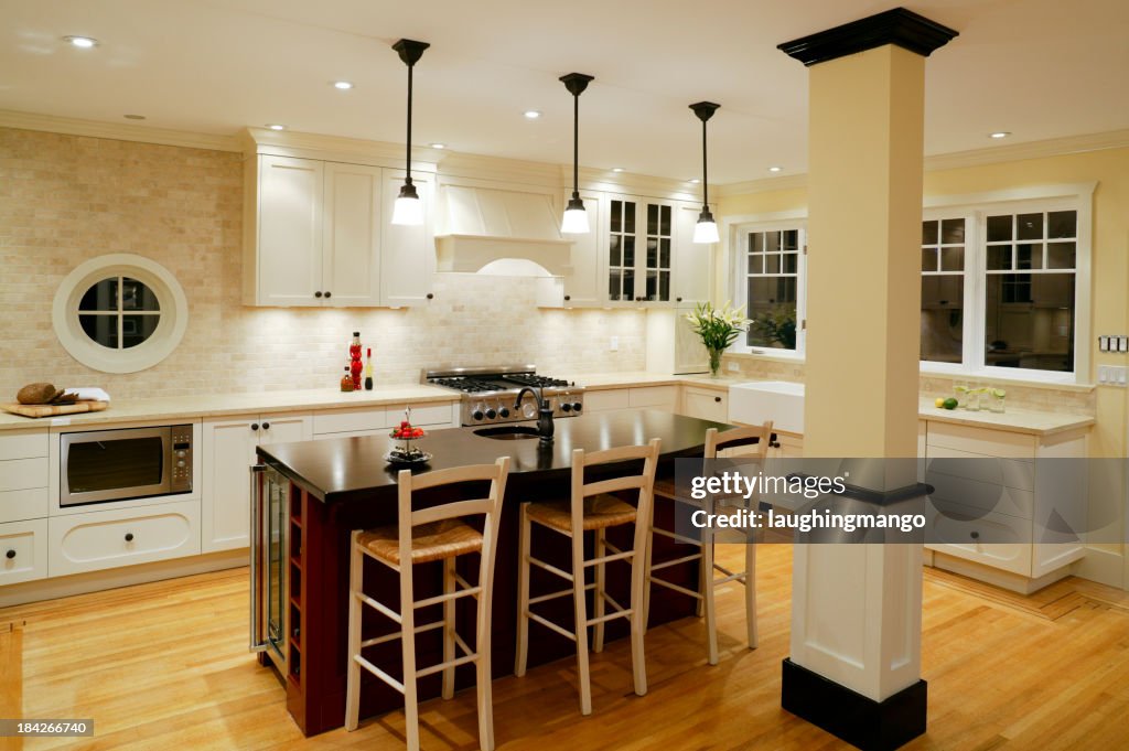 A modern kitchen interior with black and white decor