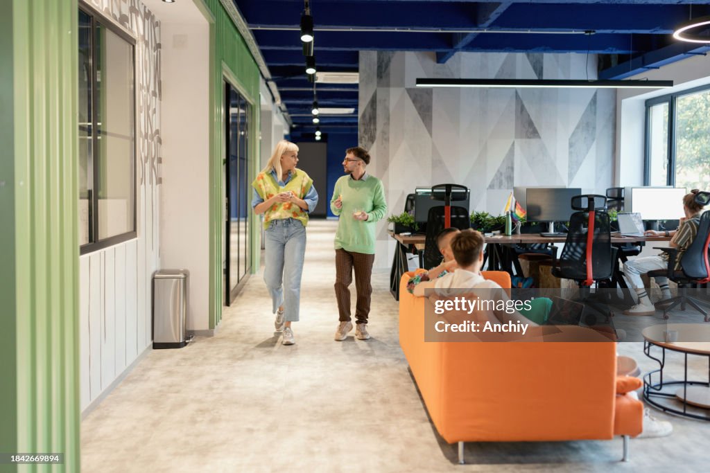 Manager talking with his colleagues in the IT company