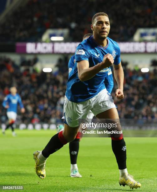 Cyriel Dessers of Rangers celebrates after he scores his team's opening goal during the Cinch Scottish Premiership match between Rangers FC and...