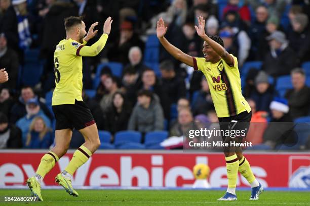 Wilson Odobert of Burnley celebrates with teammate Josh Brownhill after scoring their team's first goal during the Premier League match between...