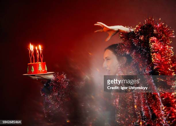 woman having fun holding birthday cake - birthday candles stock pictures, royalty-free photos & images