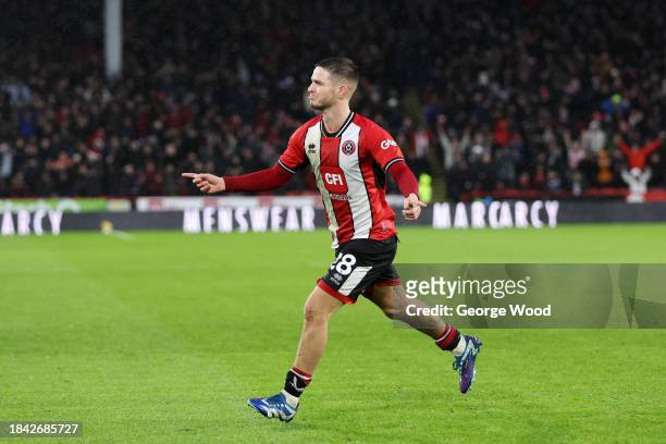 James McAtee of Sheffield United celebrates scoring their team's first goal during the Premier League match between Sheffield United and Brentford FC...