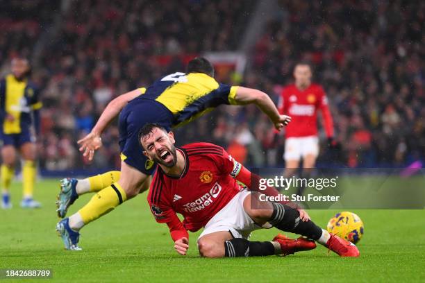 Bruno Fernandes of Manchester United reacts after being challenged by Lewis Cook of AFC Bournemouth during the Premier League match between...