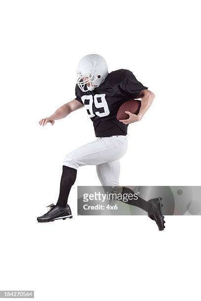 football player in action - american football player isolated stock pictures, royalty-free photos & images