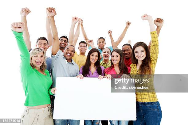 large group holding a big white board. - happy people holding a white board stock pictures, royalty-free photos & images