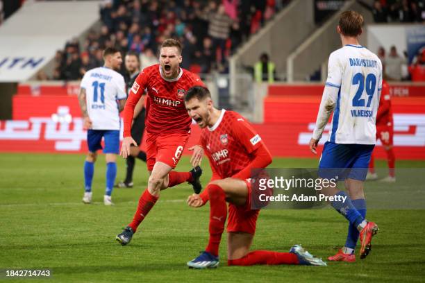 Patrick Mainka of 1.FC Heidenheim celebrates scoring their team's third goal during the Bundesliga match between 1. FC Heidenheim 1846 and SV...