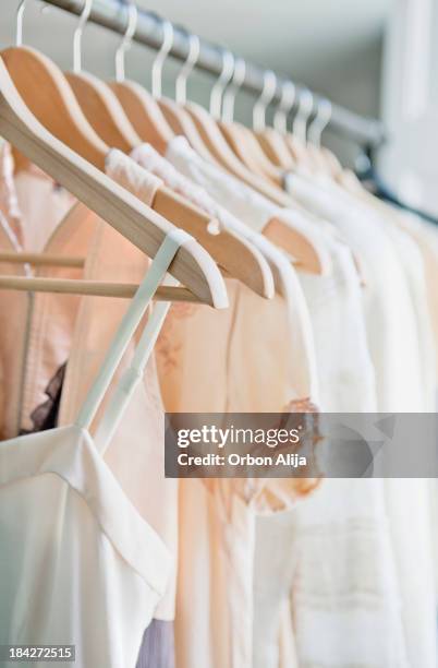 hangers with clothes - hanging clothes stock pictures, royalty-free photos & images