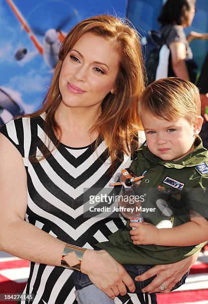Actress Alyssa Milano and son Milo Thomas Bugliari arrive at the Los Angeles premiere of 'Planes' at the El Capitan Theatre on August 5, 2013 in...