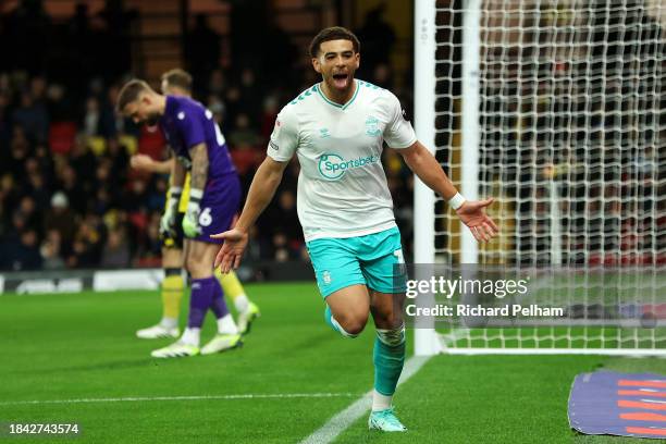 Che Adams of Southampton celebrates scoring their team's first goal during the Sky Bet Championship match between Watford and Southampton FC at...