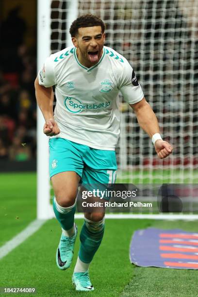 Che Adams of Southampton celebrates scoring their team's first goal during the Sky Bet Championship match between Watford and Southampton FC at...