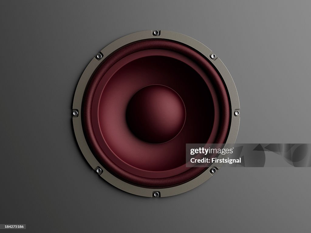 Red loudspeaker on grey background