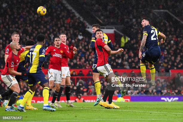 Marcos Senesi of AFC Bournemouth scores their team's third goal during the Premier League match between Manchester United and AFC Bournemouth at Old...